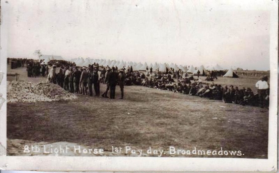Faded photograph of line of soldiers