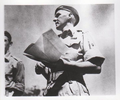 Soldier in summer uniform holding map