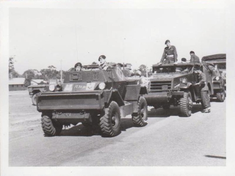 Two armoured vehicles and soldiers