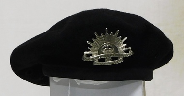 Black cloth beret with large badge