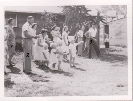 Group of men and women arranging a race for children.