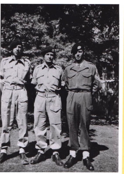 Three soldiers in different uniforms; all wearing berets.