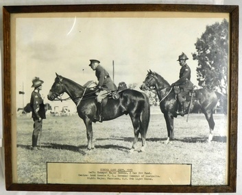 Picture of three soldiers, two on horseback.