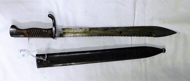 large knife with saw teeth along back of blade