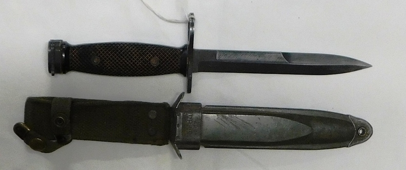 Short chunky knife with sheath.