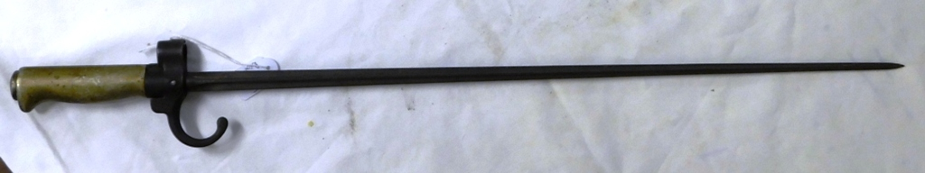 Long thin pointed bayonet with brass handle