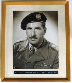 Army officer in winter uniform and beret.