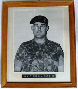 Army officer wearing camouflage uniform and beret
