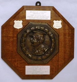 Wooden board with heavy metal image and several small plates on it.