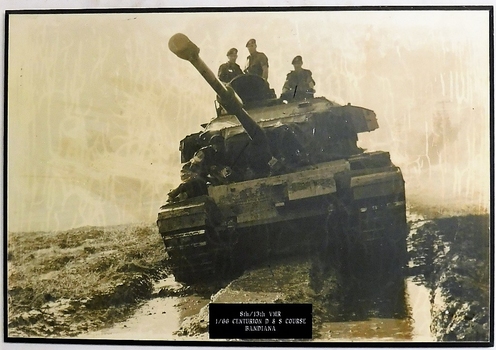 Tank with crew sitting on top for photograph