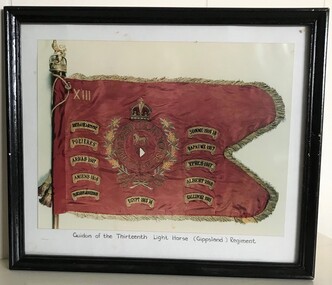 Photograph of flag with tags around edges.
