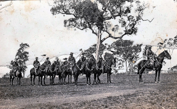 Soldiers with lances on horses.