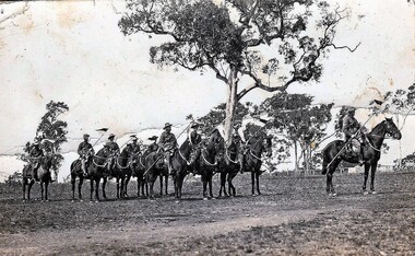 Soldiers with lances on horses.
