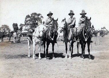 Three soldiers with four horses.