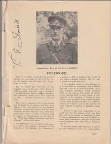 Magazine with photo of soldier on page.