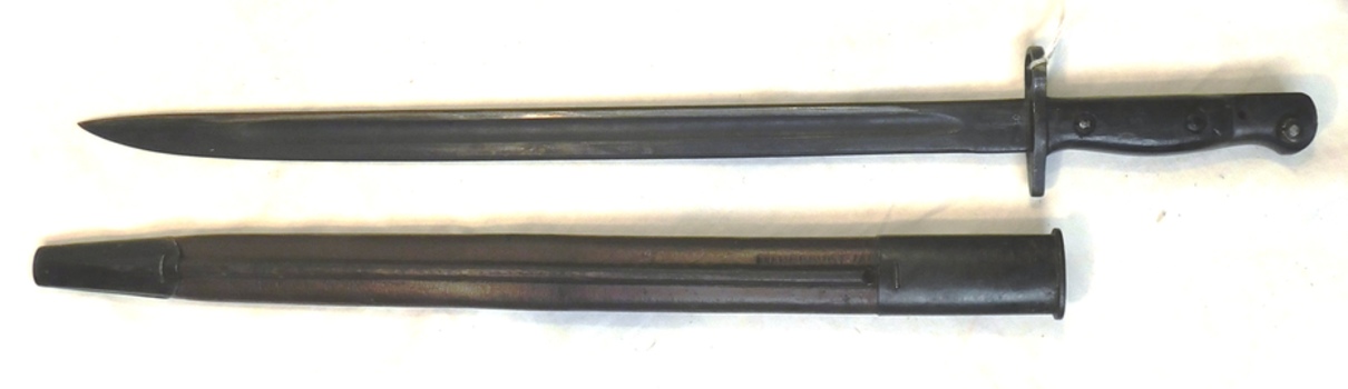 Long knife with a leather sheath.