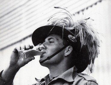 Soldier drinking from a glass