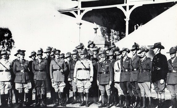 Group of soldiers beside grand stand
