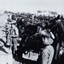 Tents, soldiers and many horses.