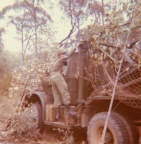 Soldier on running board large vehicle