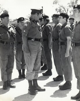 Officer talking to soldier at parade
