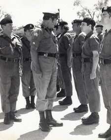 Officer talking to soldier at parade