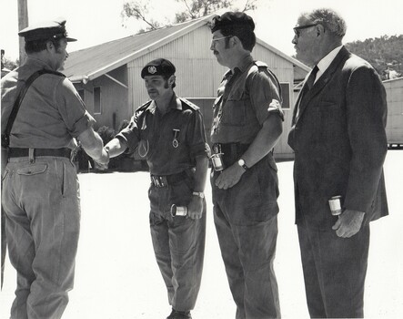 Three soldiers and one civilian
