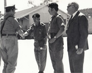 Three soldiers and one civilian