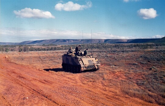 Tracked vehicle in semi desert.