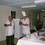 Two soldier cooks relaxing after preparing food