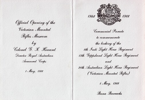 Folded card with printing and emblem.
