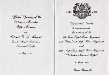Folded card with printing and emblem.