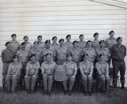 Group of soldiers with trophy.