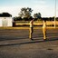 Two soldiers on a parade ground saluting 