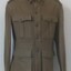 Soldier's jacket with buttons and badges on it.