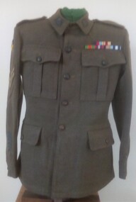 Soldier's jacket with coloured badges.