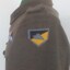 Soldier's jacket with colouful badge on shoulder