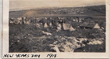 Soldiers camped in rocky ground