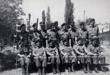 Group of 15 soldiers posed for photo.