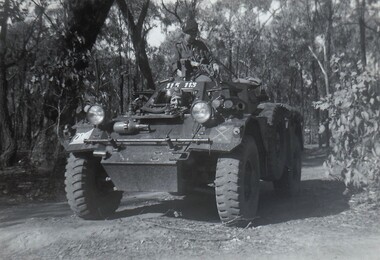 Army scout car on bush track.