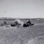 Tanks in paddock firing guns