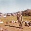 Soldier with belts of ammunition over shoulder.     