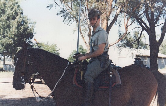 Soldier on horseback with sword