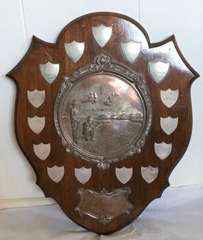 Decorative wooden and metal shooting trophy.