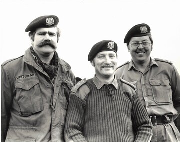 Three army officers in field dress