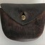 Leather watch case with belt loop.