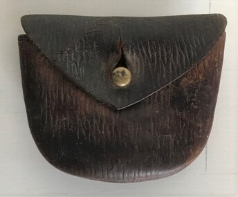 Leather watch case with belt loop.