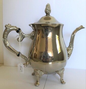 silver pot with handle and spout