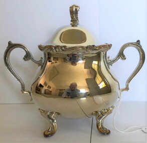 A bowl with two handles and lid.