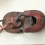 folding leather wallet showing horse shoes.